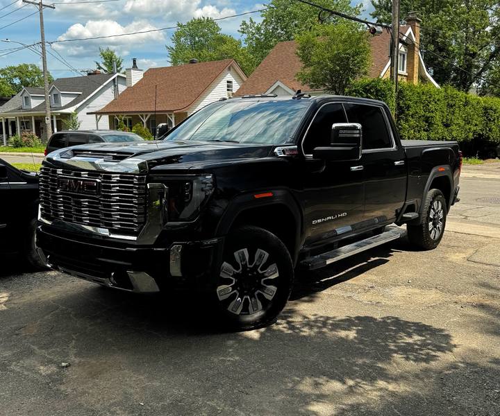 Black GMC Sierra Denali with blacked-out grille and trim after a chrome delete